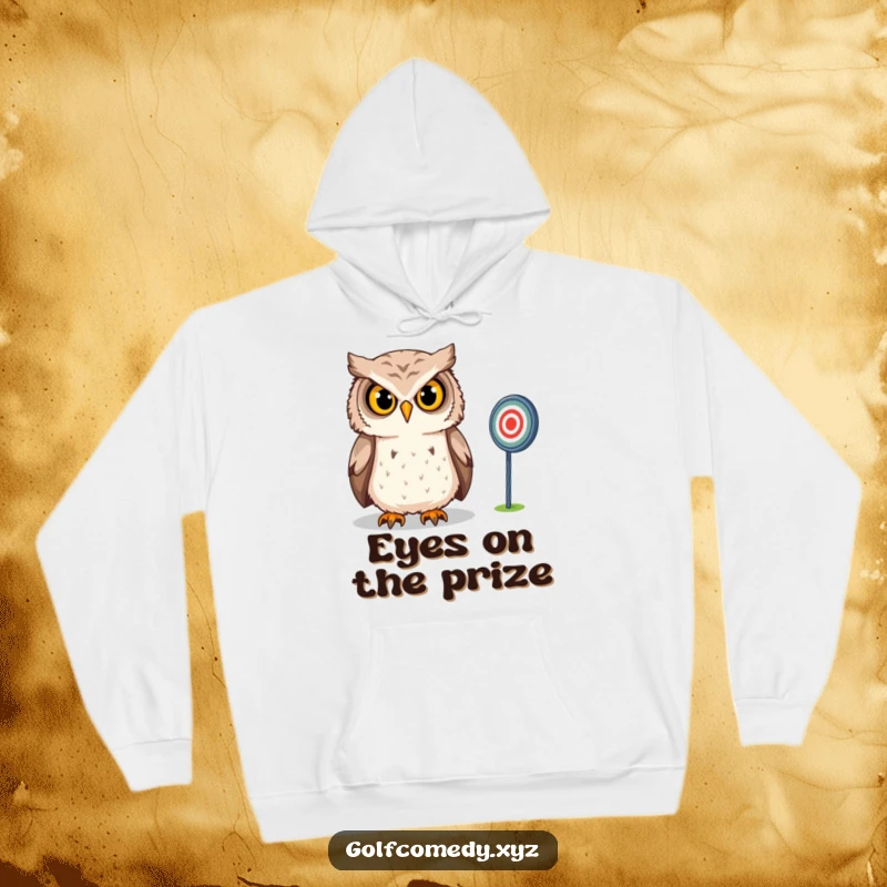 Funny Owl Hoodie: A confident owl intensely gazes at a distant golf target, offering a warm and humorous addition for golf enthusiasts.